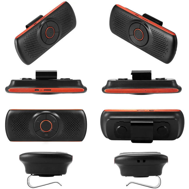 Orange Bluetooth car hands-free speaker unit mounted on a car sun visor