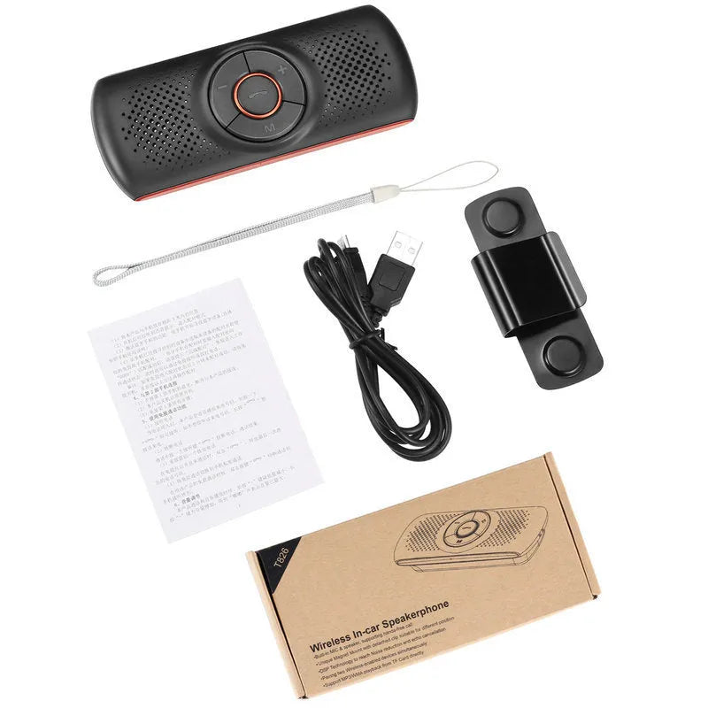 Orange Bluetooth car hands-free speaker unit mounted on a car sun visor
