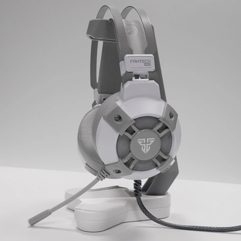 Black FANTECH HG11 USB gaming headset with RGB LED lights and a remote control on its cable.