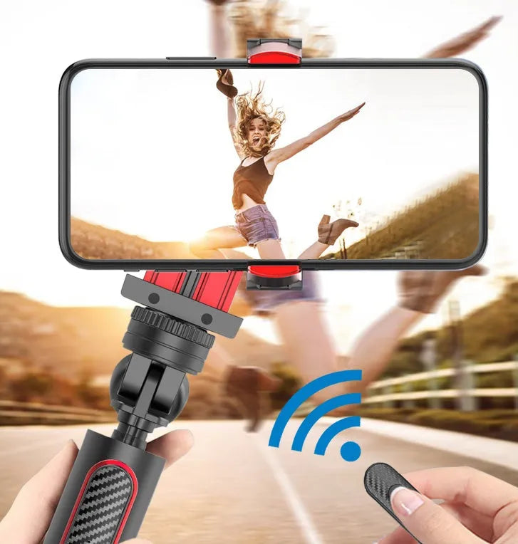 Black aluminium phone tripod with extended legs and a smartphone mounted in the clamp