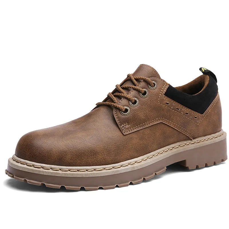 Men's black round-toe casual lace-up trainers with a flat rubber sole on a white background.