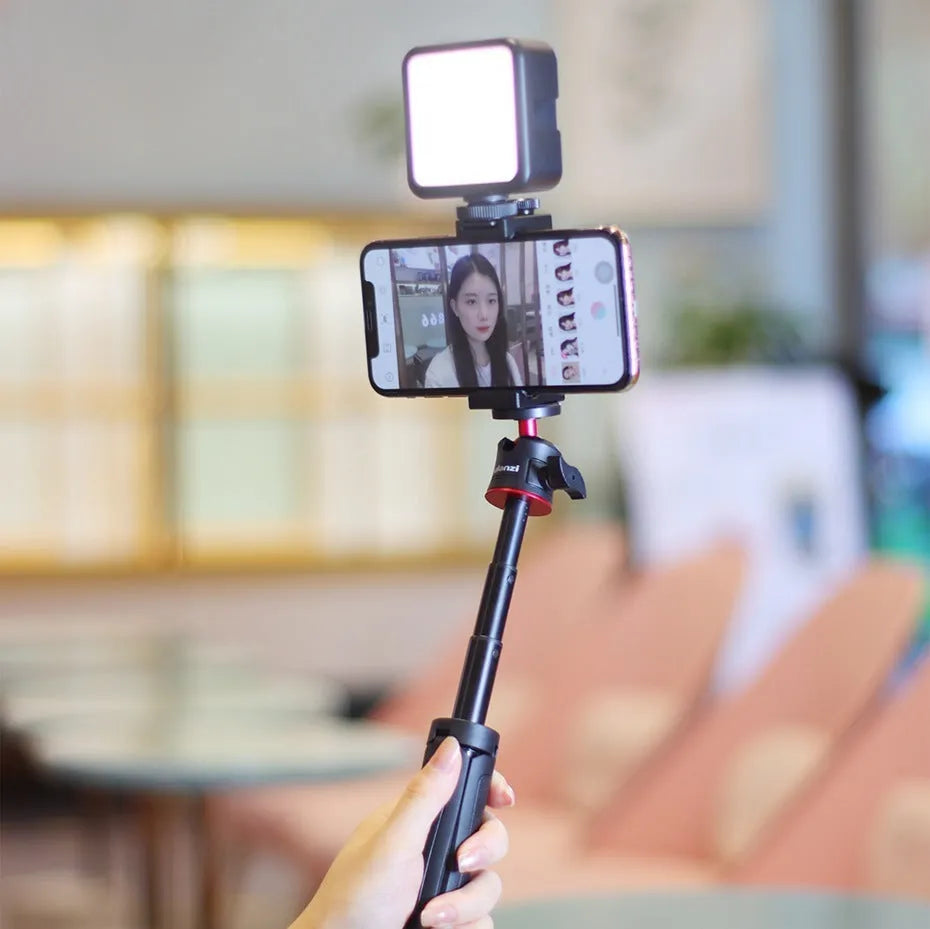 Mobile phone vlog selfie stick set with adjustable fill light bracket and phone stand.