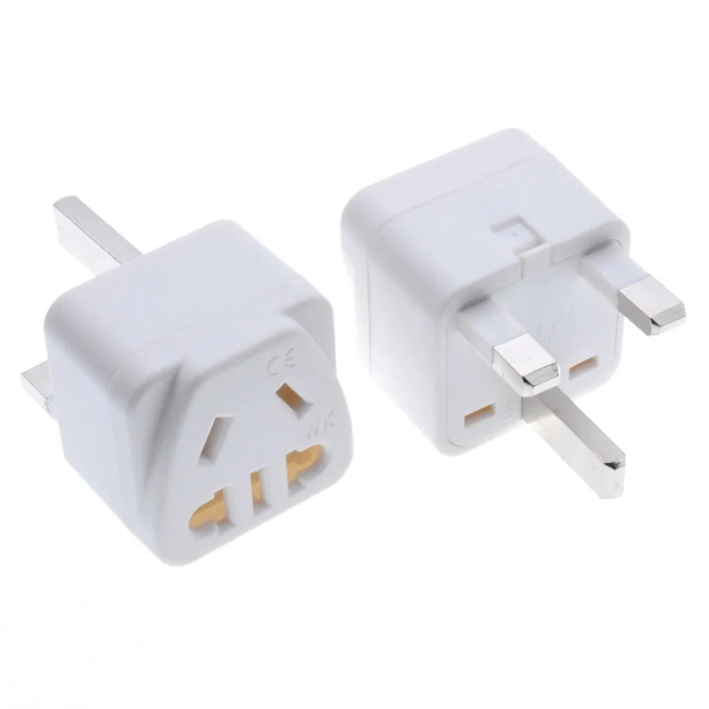 White international travel power adapter with UK three-pin plug and five sockets for 2-pin plugs.