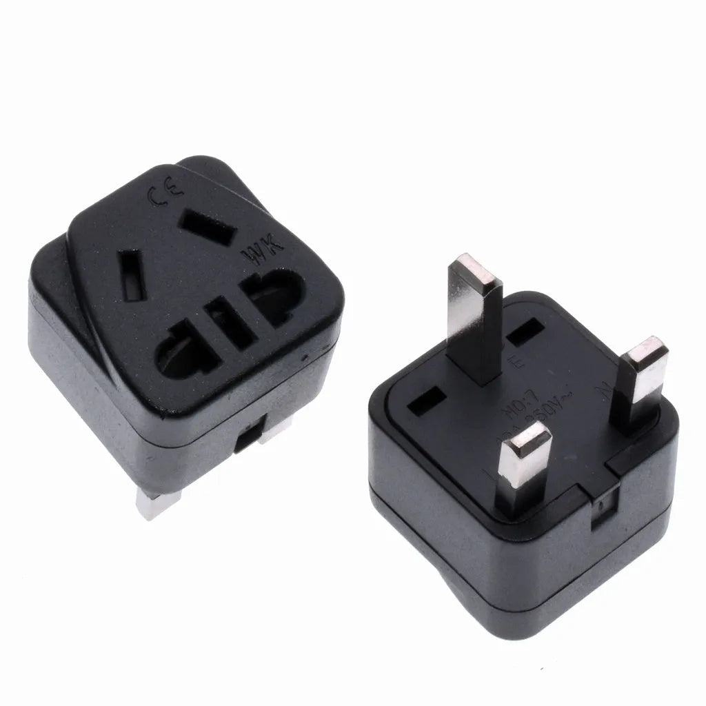 White international travel power adapter with UK three-pin plug and five sockets for 2-pin plugs.