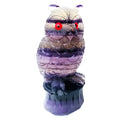 Purple fluorite carved owl statue on white background showing detailed hand carving