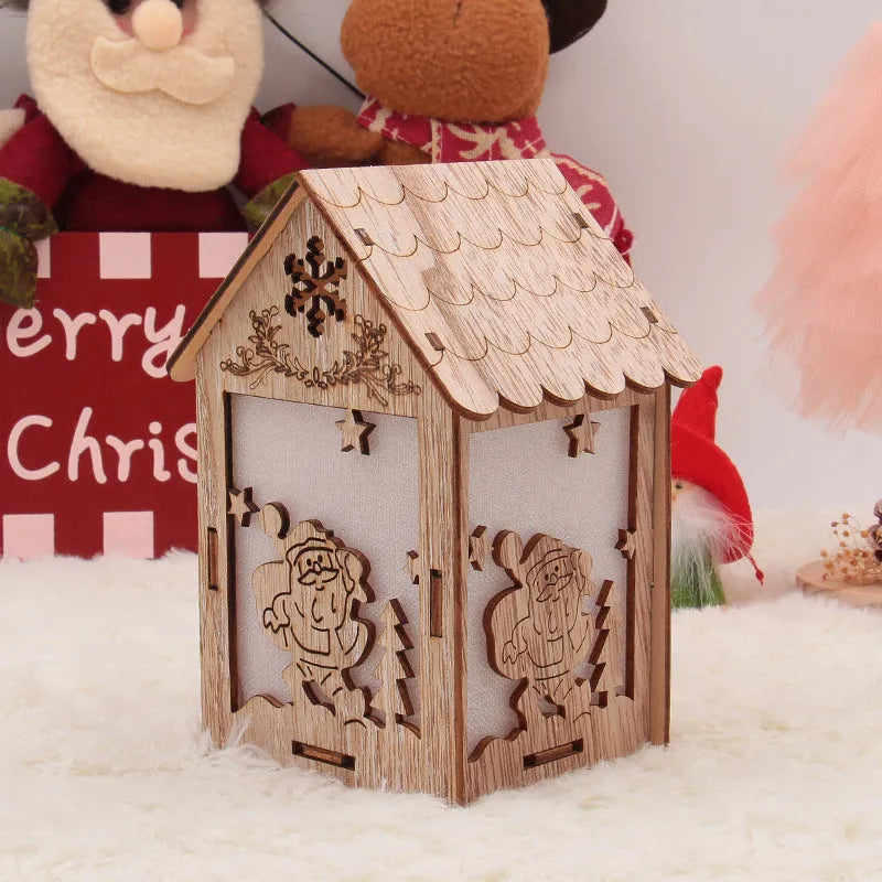 Set of three handmade wooden Christmas decorations: small log bell, wooden house Santa, wooden house snowman