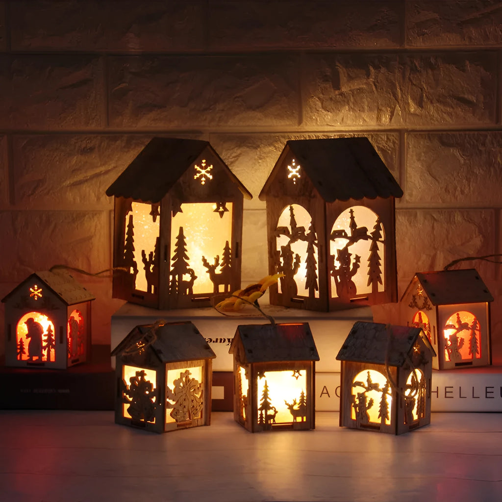 Set of three handmade wooden Christmas decorations: small log bell, wooden house Santa, wooden house snowman