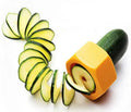 Yellow and green food-grade ABS plastic spiral vegetable cutter for slicing cucumbers.