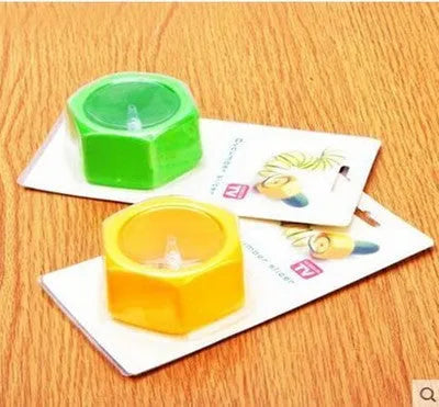 Yellow and green food-grade ABS plastic spiral vegetable cutter for slicing cucumbers.