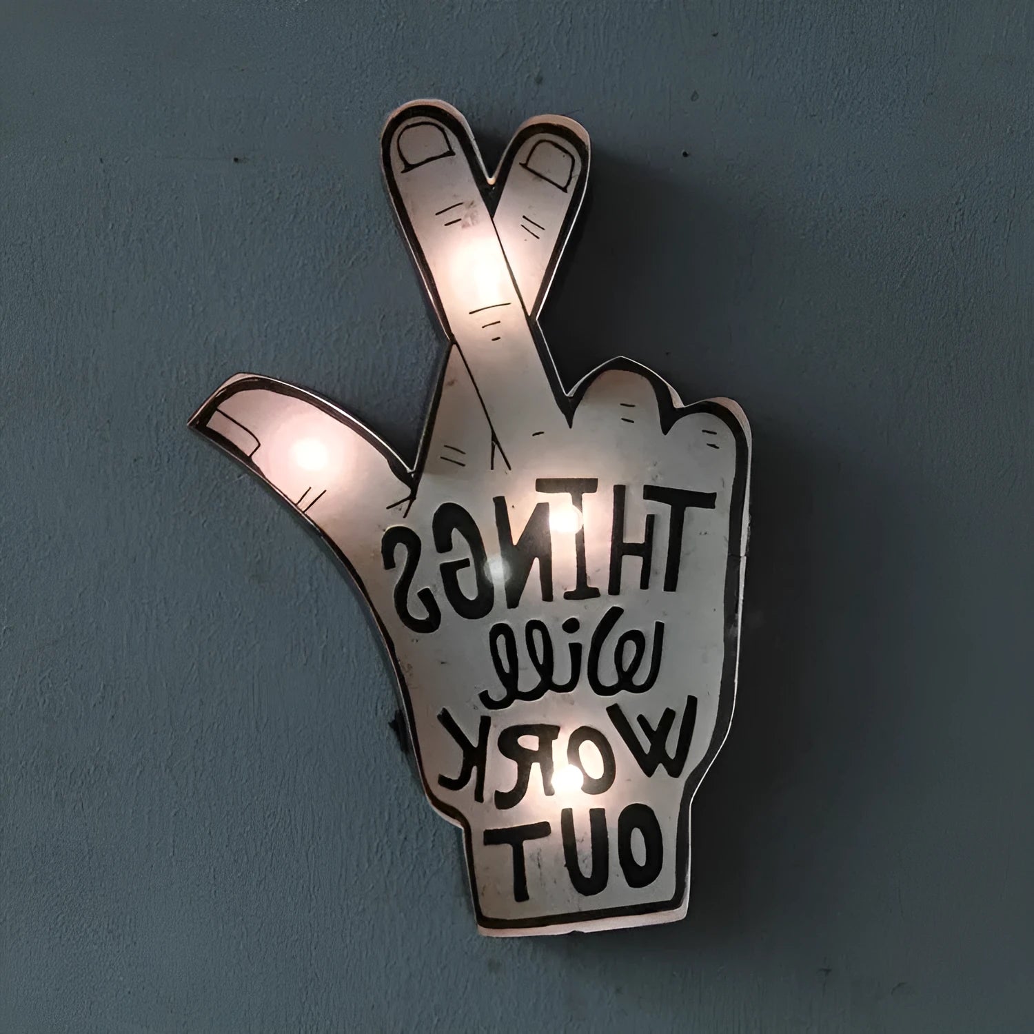 Vintage style flexible LED neon sign light on an iron frame, shown bent into a shape, for wall decoration.