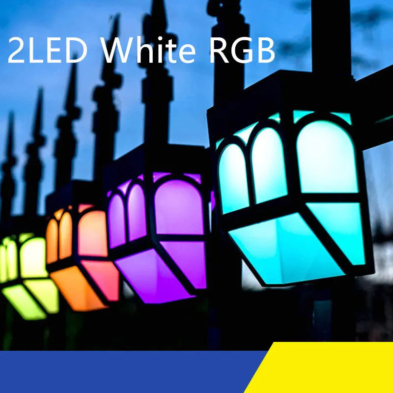 Square white solar-powered outdoor wall lamp mounted on a wooden fence post.