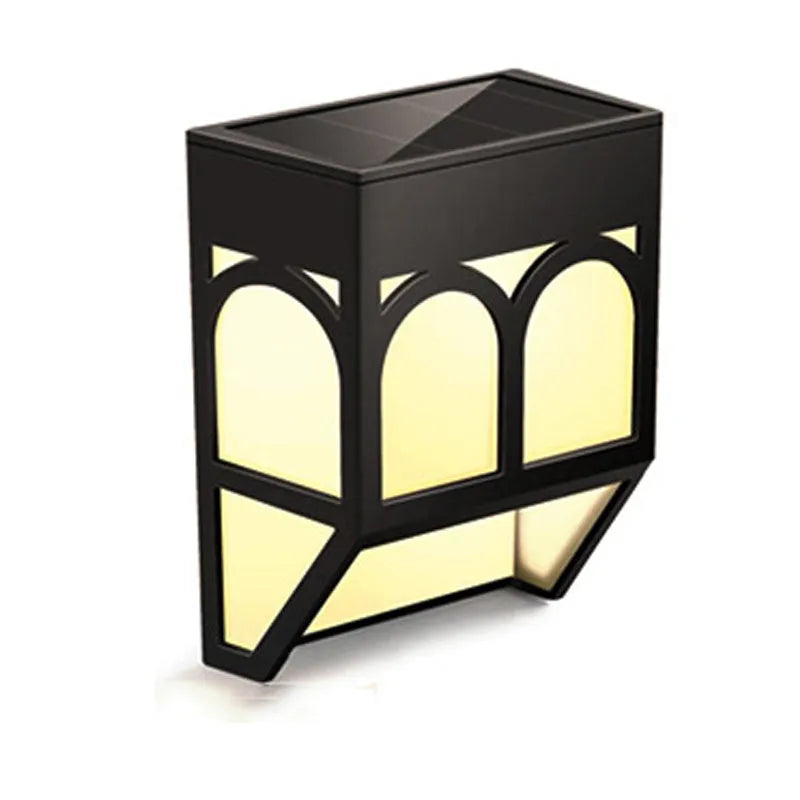 Square white solar-powered outdoor wall lamp mounted on a wooden fence post.