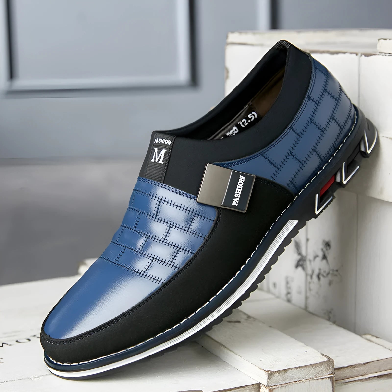 Men's casual leather shoes in black, blue, and brown colours showing low-cut design
