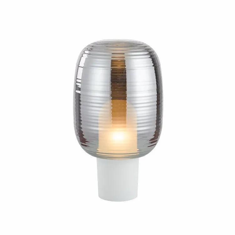 Simple modern Nordic style glass table lamp in cognac colour with push button switch.
