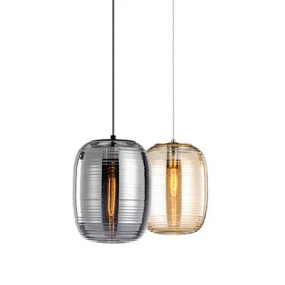 Simple modern Nordic style glass table lamp in cognac colour with push button switch.