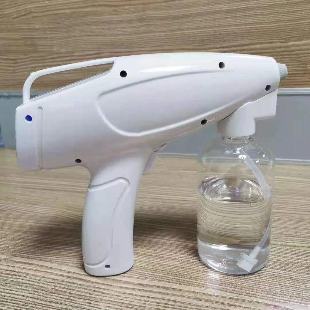 White handheld wireless electric disinfectant spray gun with USB charging port.