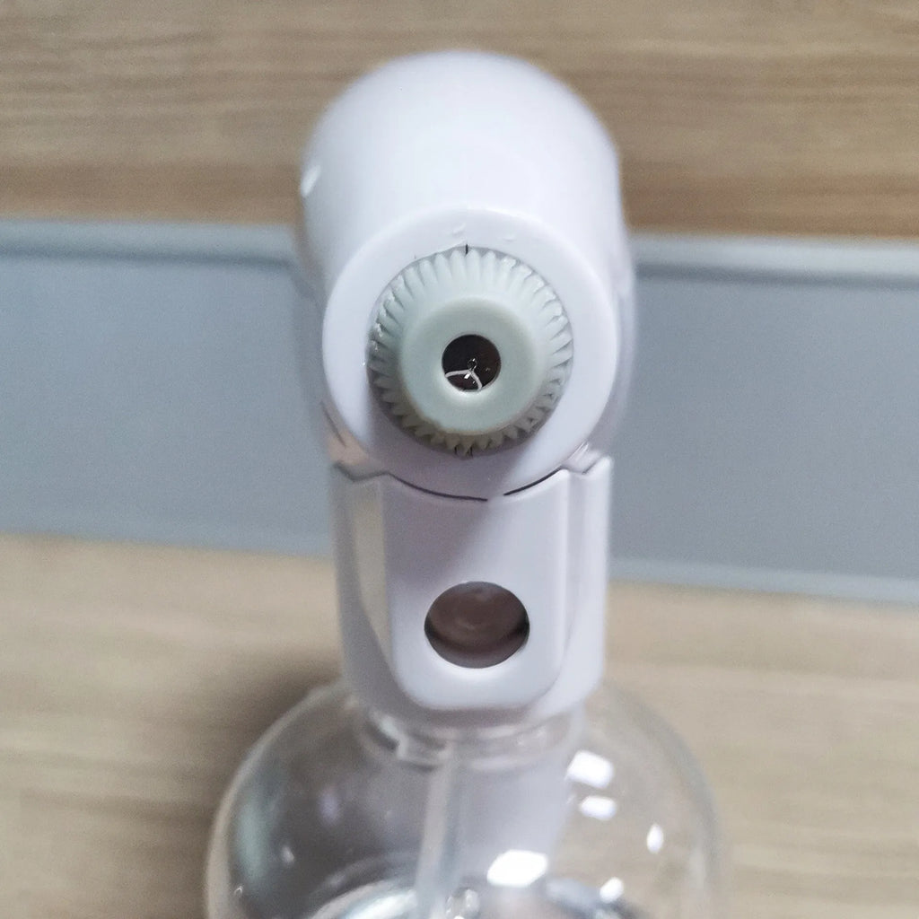 White handheld wireless electric disinfectant spray gun with USB charging port.