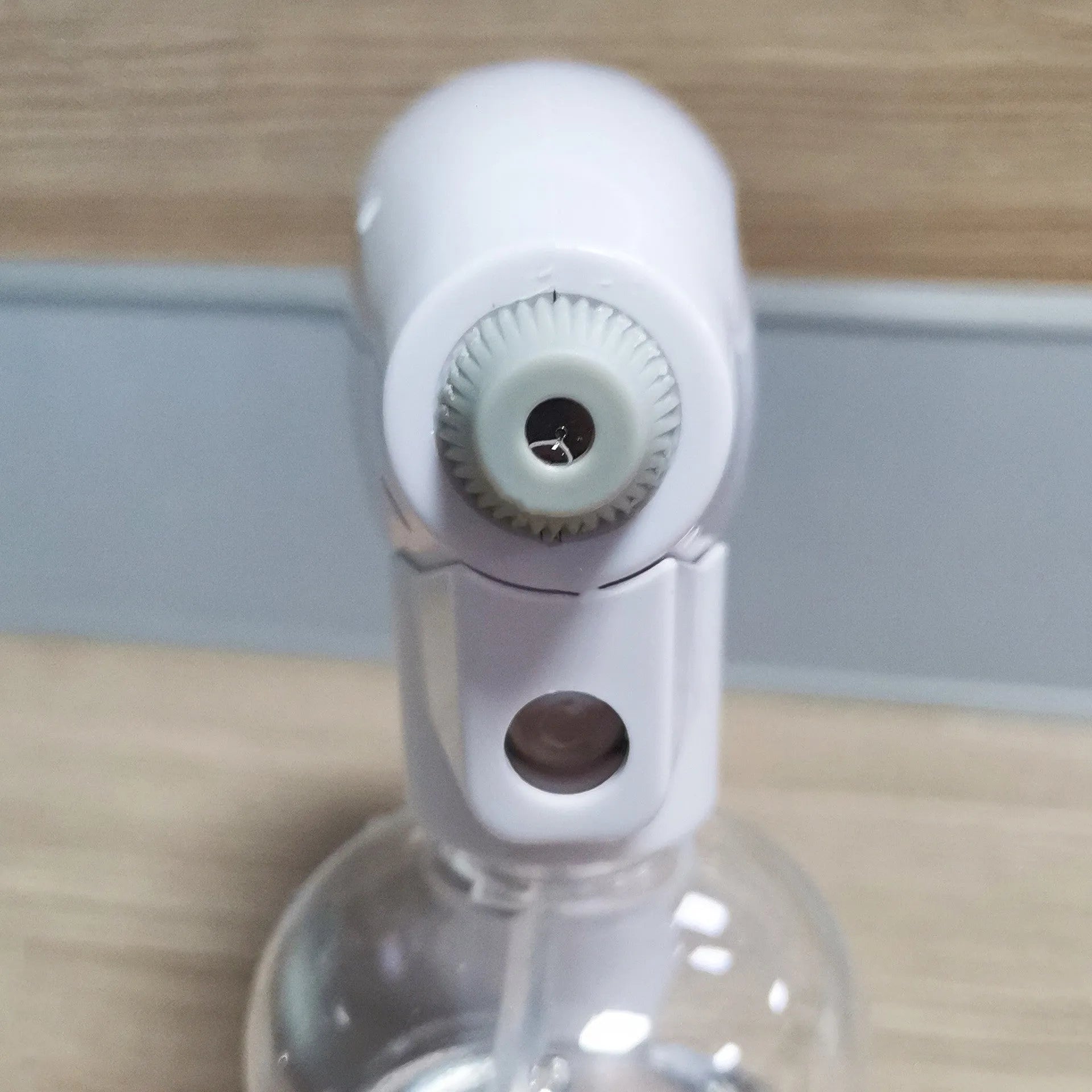 White handheld wireless electric disinfectant spray gun with USB charging port.