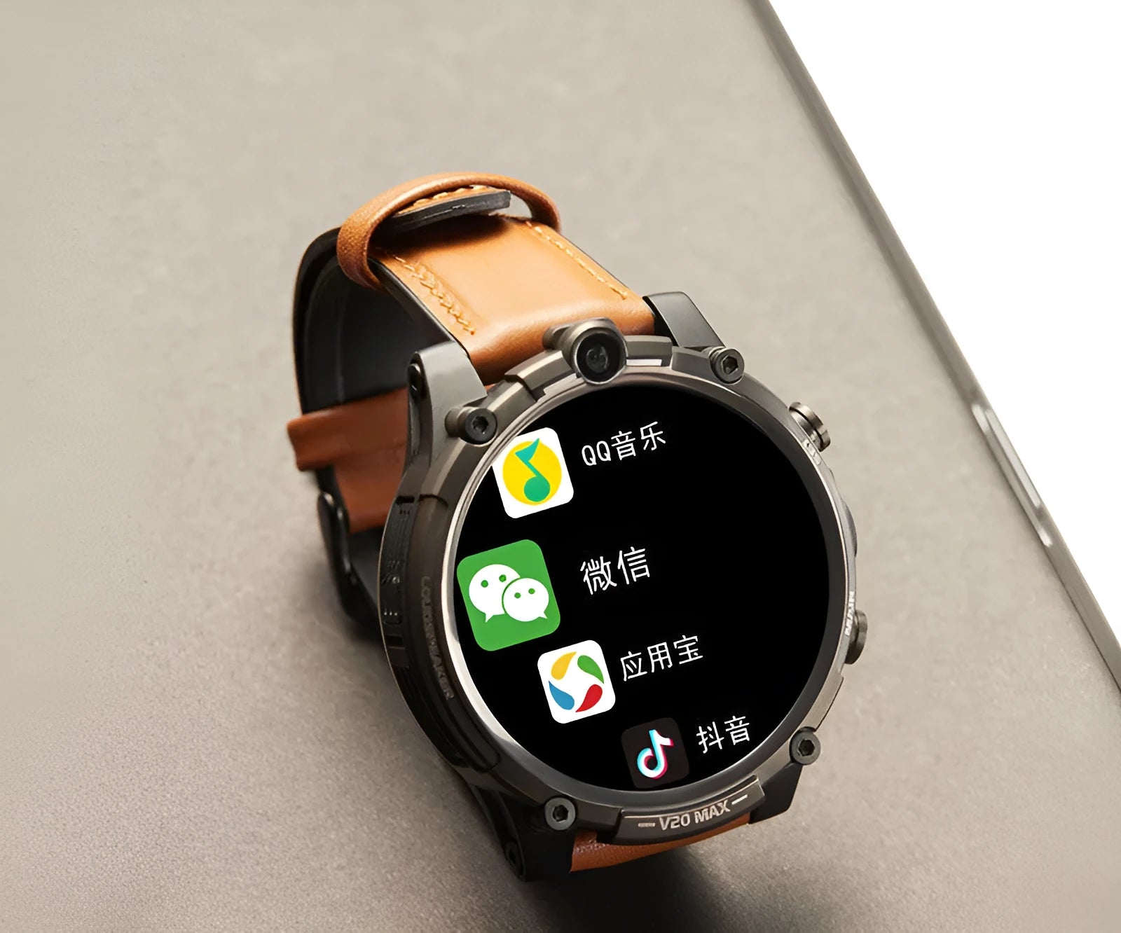 Black 4G smart phone watch with 1.6 inch screen, dual cameras, and wrist strap on adult arm