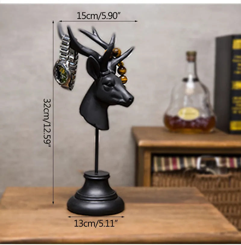 Natural resin decorative animal sculpture in black, white, or wood colour on a wooden table.