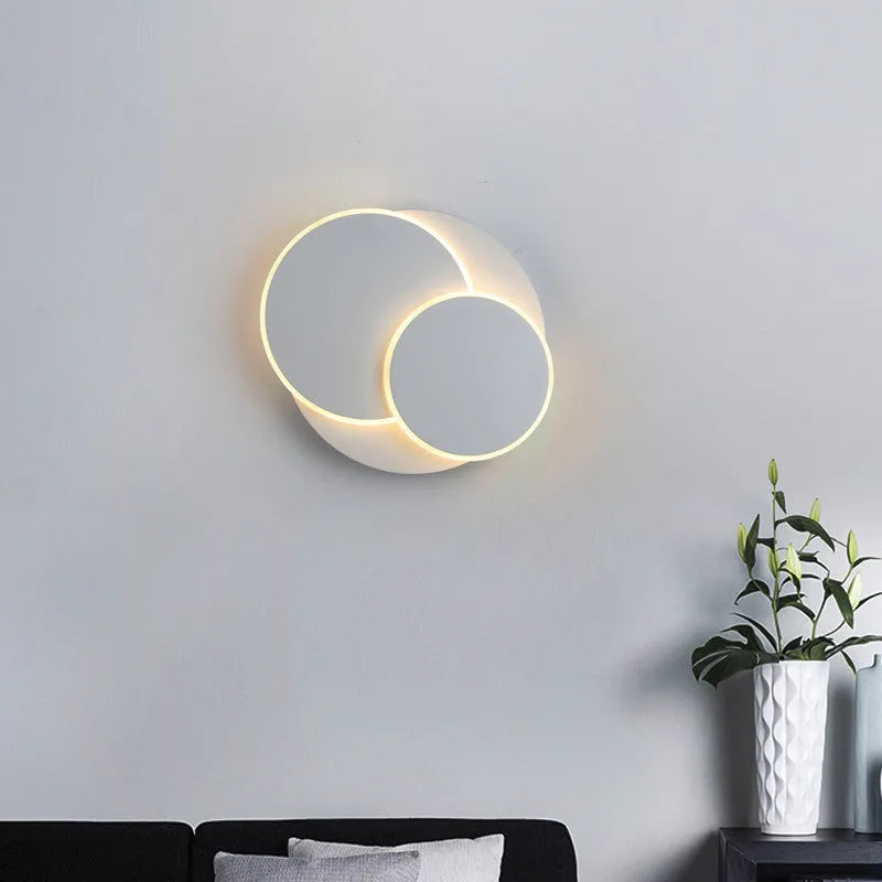 Simple modern round wall lamp in black or white acrylic finish for living room or bedroom LED lighting
