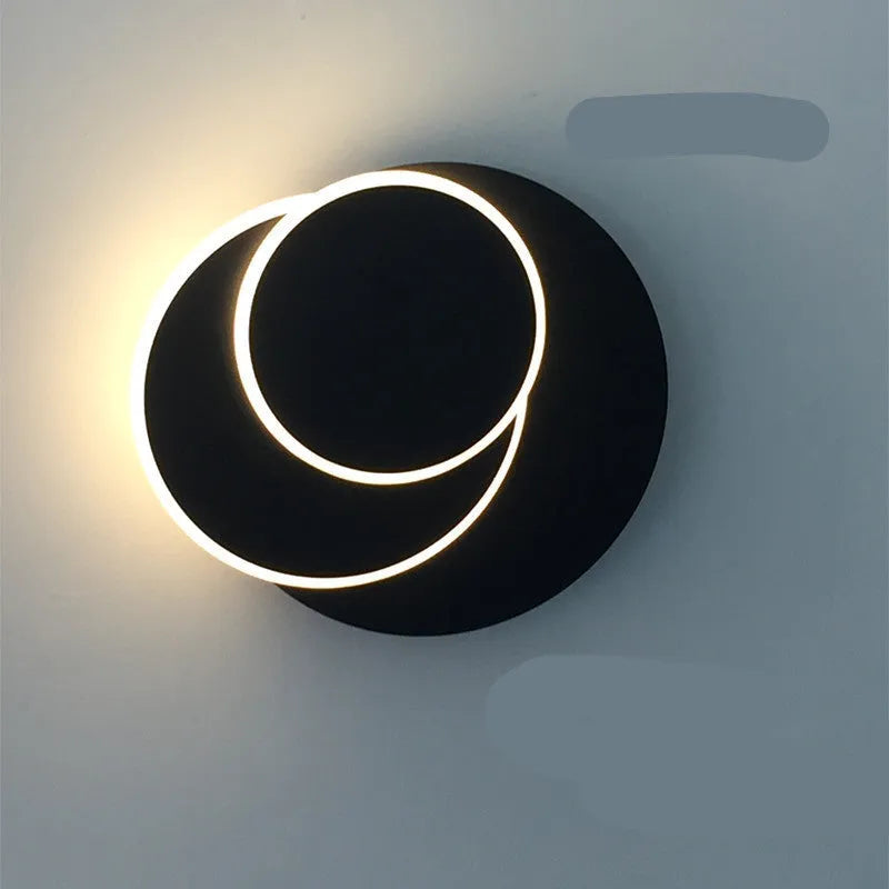 Simple modern round wall lamp in black or white acrylic finish for living room or bedroom LED lighting
