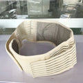 Black self-heating waist protection fixed belt with magnetic therapy for lumbar support on a beige background.