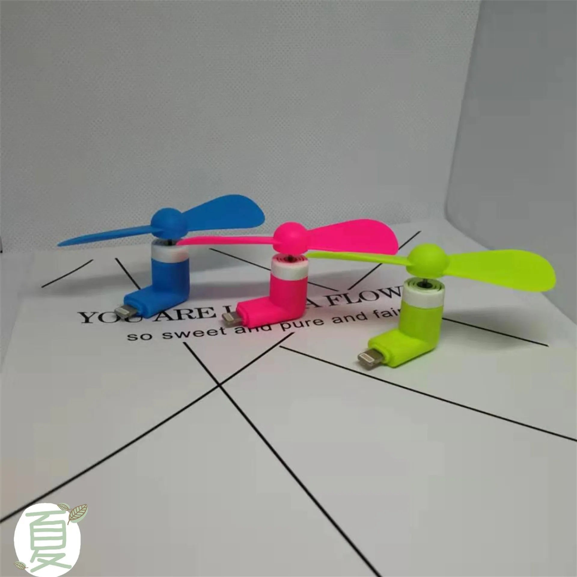 White portable mobile phone mini fan with rotary switch and plastic blades for smartphone cooling