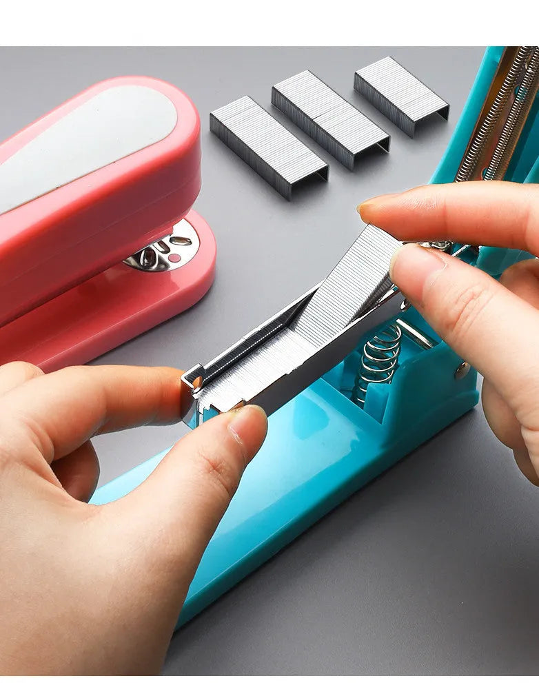 360-degree rotatable desk stapler in multiple colours showing binding directions and centre seam function.