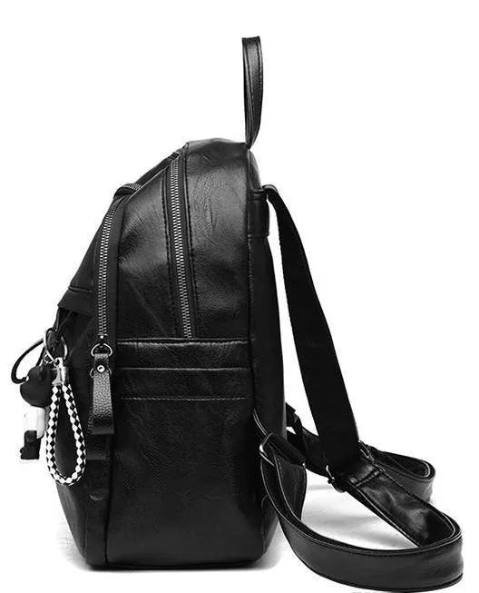 Black soft surface PU leather backpack with double straps showing ID compartment and zipper opening