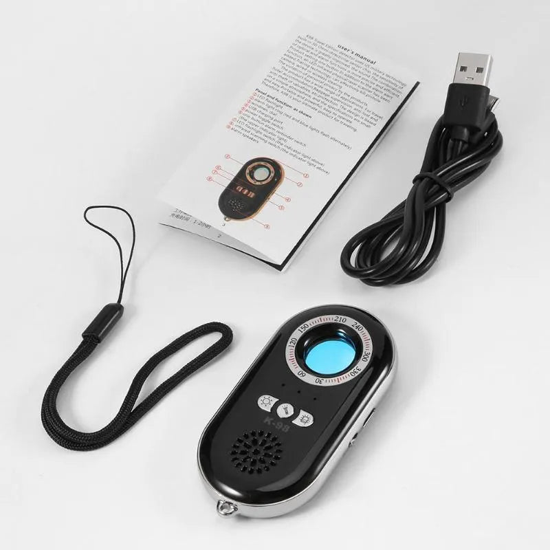 Compact rectangular wireless signal detector with vibration alarm for travel security and hidden camera detection.