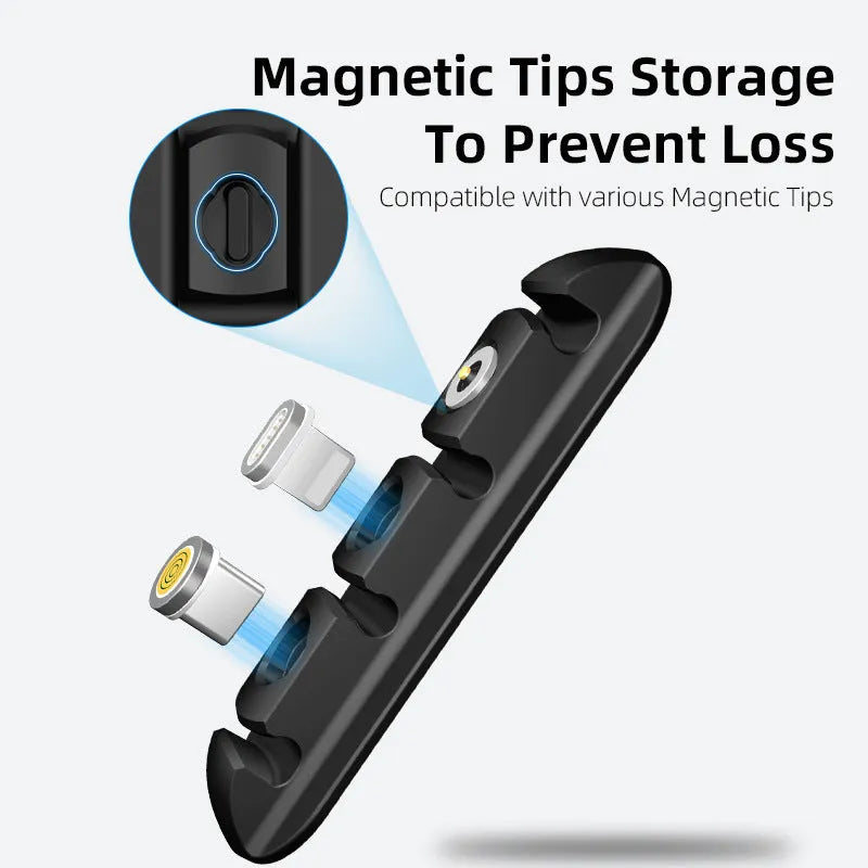 Black soft plastic desktop magnetic charging cable organizer on a wooden desk.