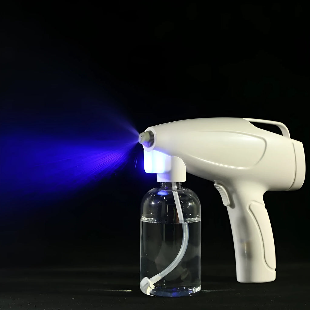 White handheld wireless electric disinfectant spray gun with USB charging port.