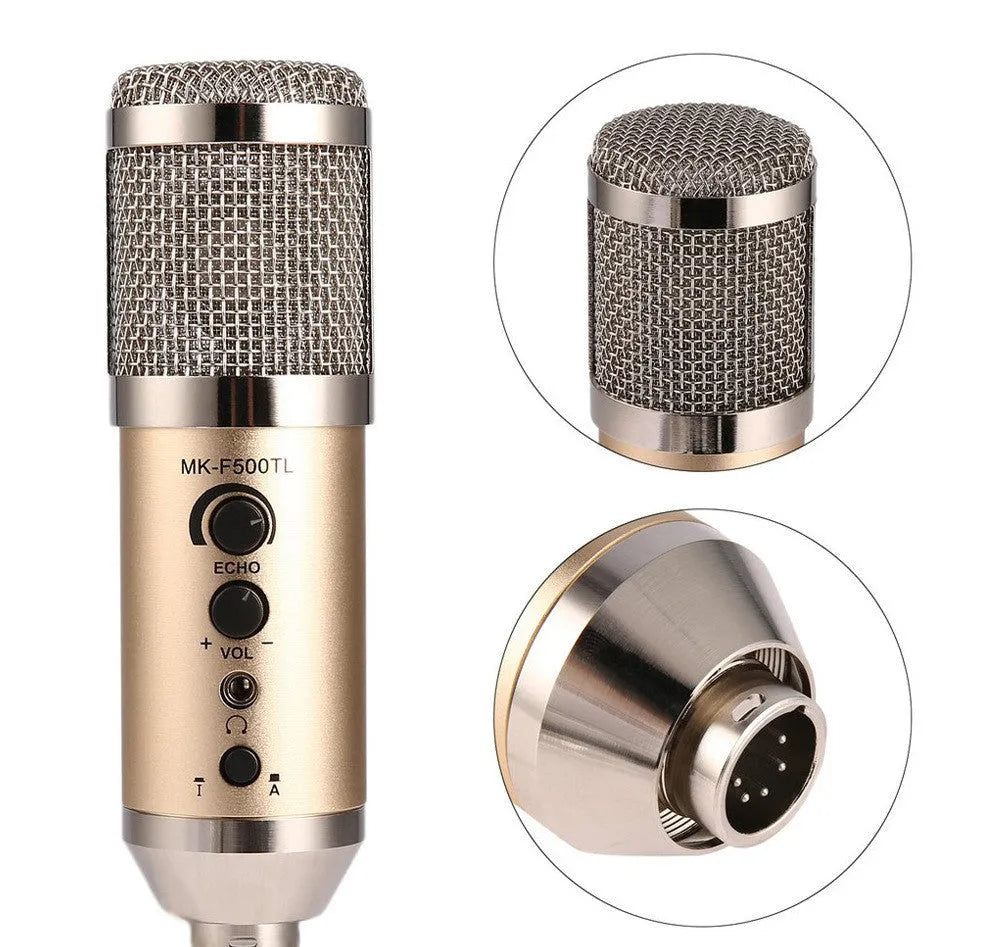 Gold coloured USB condenser microphone with bracket on a desk.