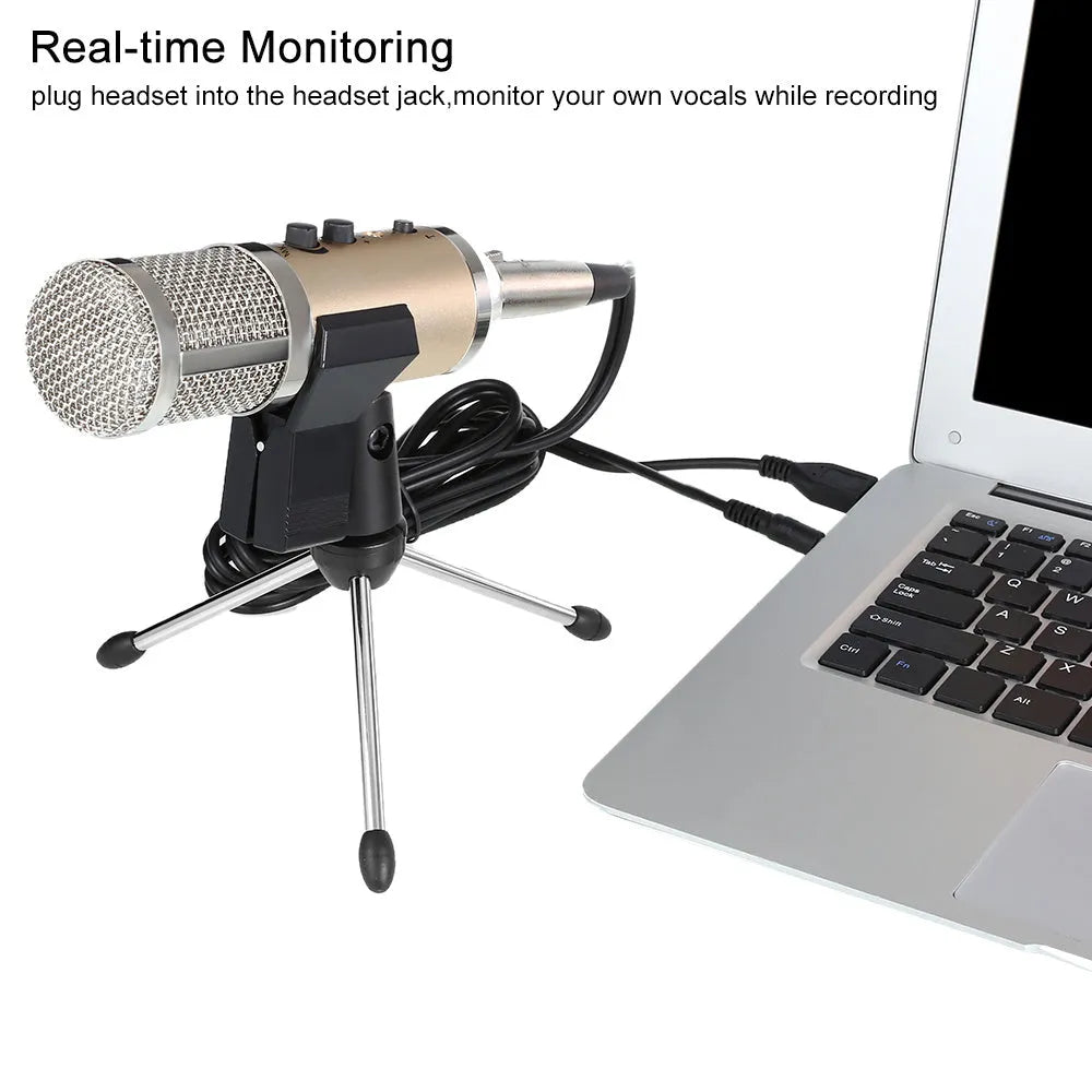 Gold coloured USB condenser microphone with bracket on a desk.