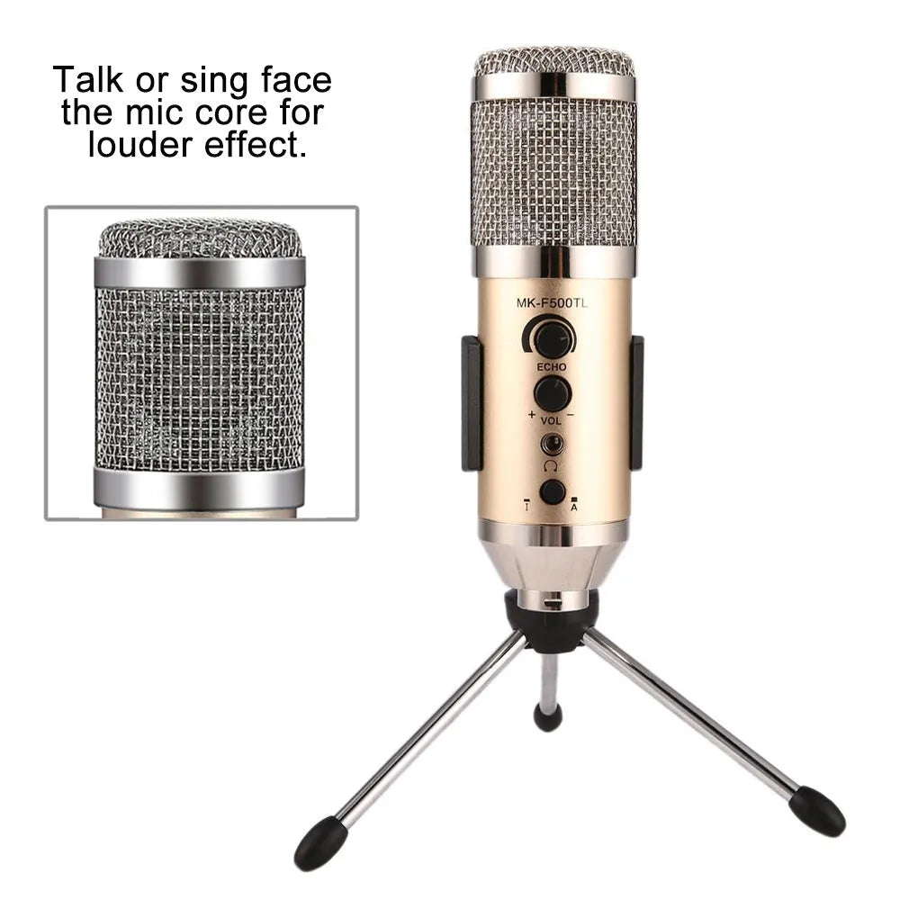 Gold coloured USB condenser microphone with bracket on a desk.