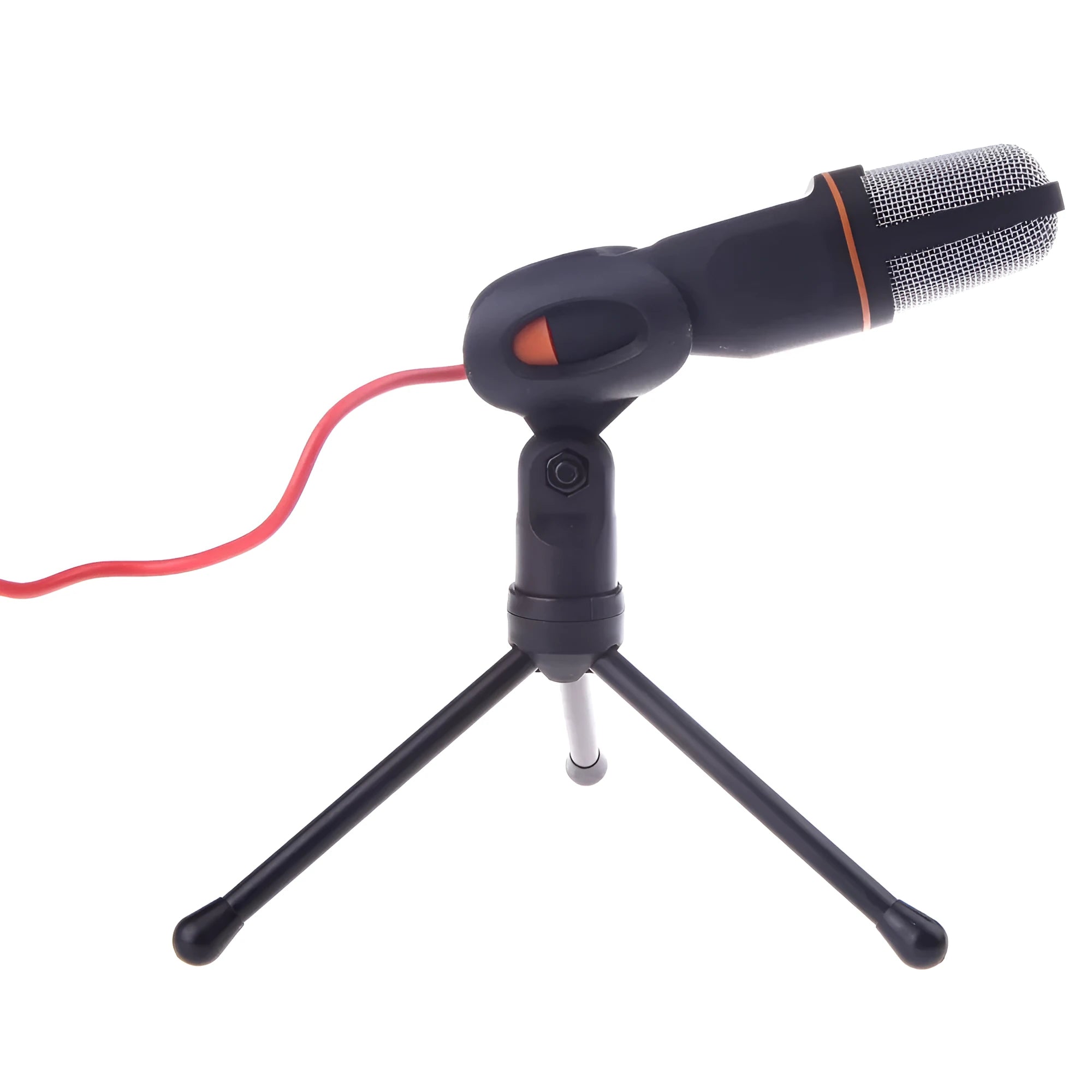 Black wired computer microphone with mounting bracket on desk next to laptop