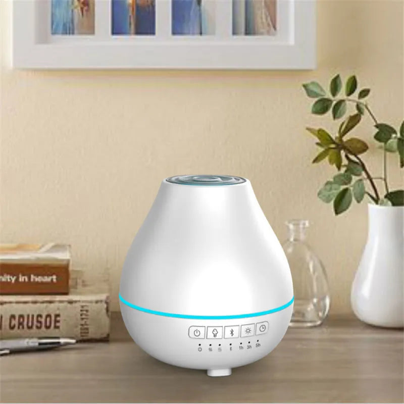 Round white Bluetooth humidifier and aroma diffuser with essential oil tank and night light.
