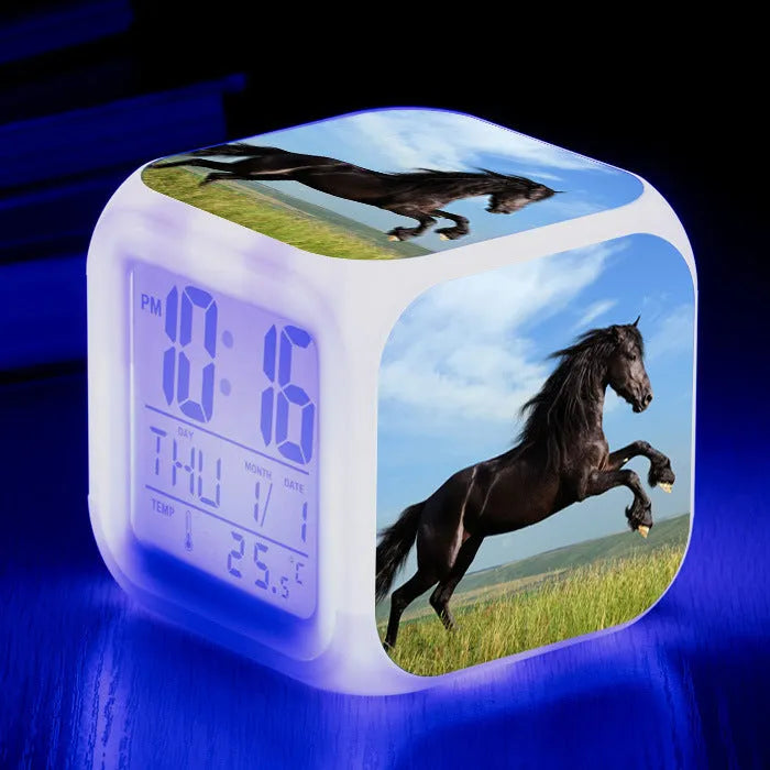Small square creative alarm clock with colourful LED display showing time and weekday.