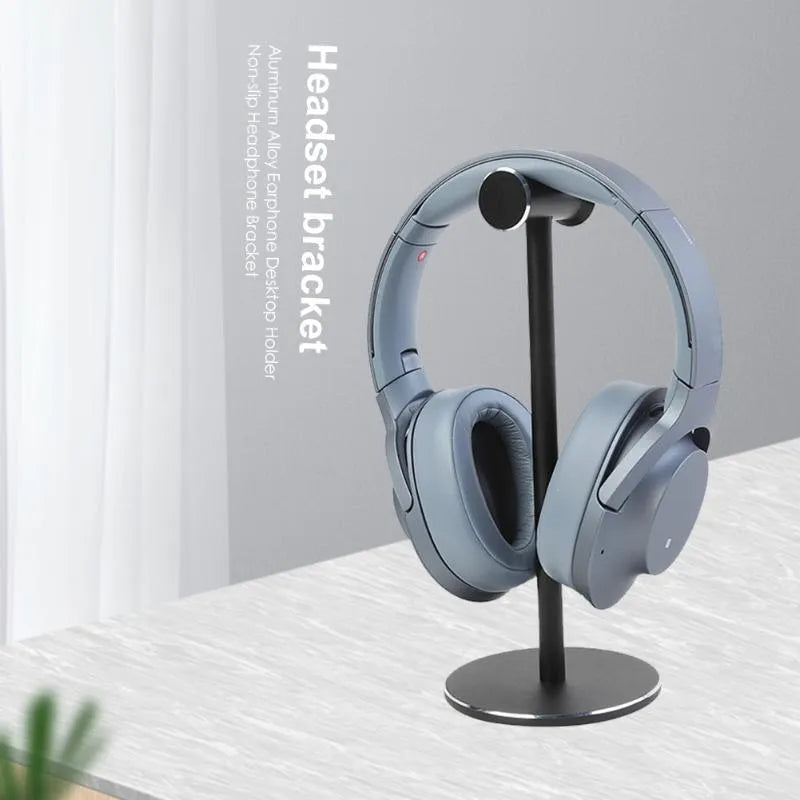 Aluminum alloy black headset bracket storage rack on desk holding a gaming headset