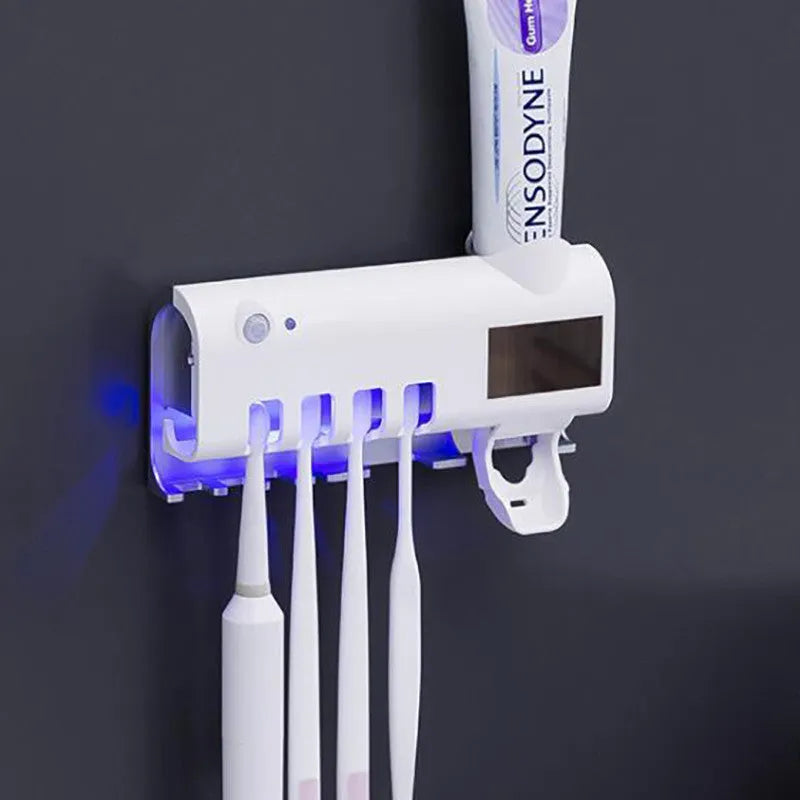 Wall-mounted UV toothbrush sterilizer with automatic toothpaste squeezer in black finish