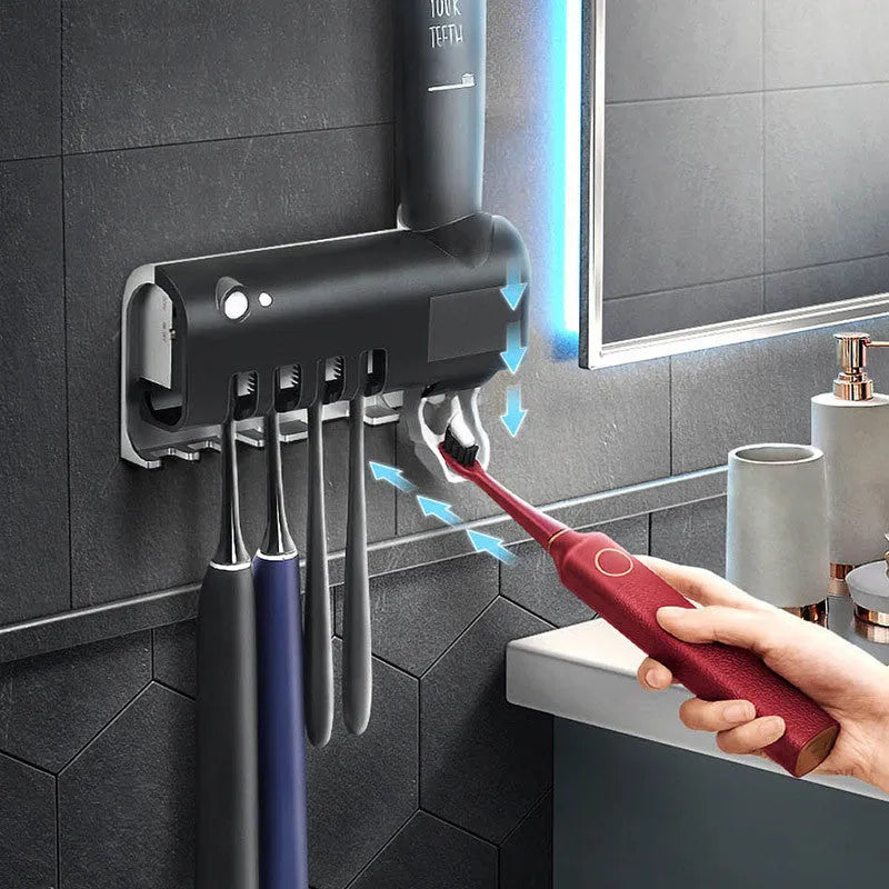 Wall-mounted UV toothbrush sterilizer with automatic toothpaste squeezer in black finish