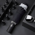 Black automatic reverse folding umbrella with reflective cloth, shown open and closed