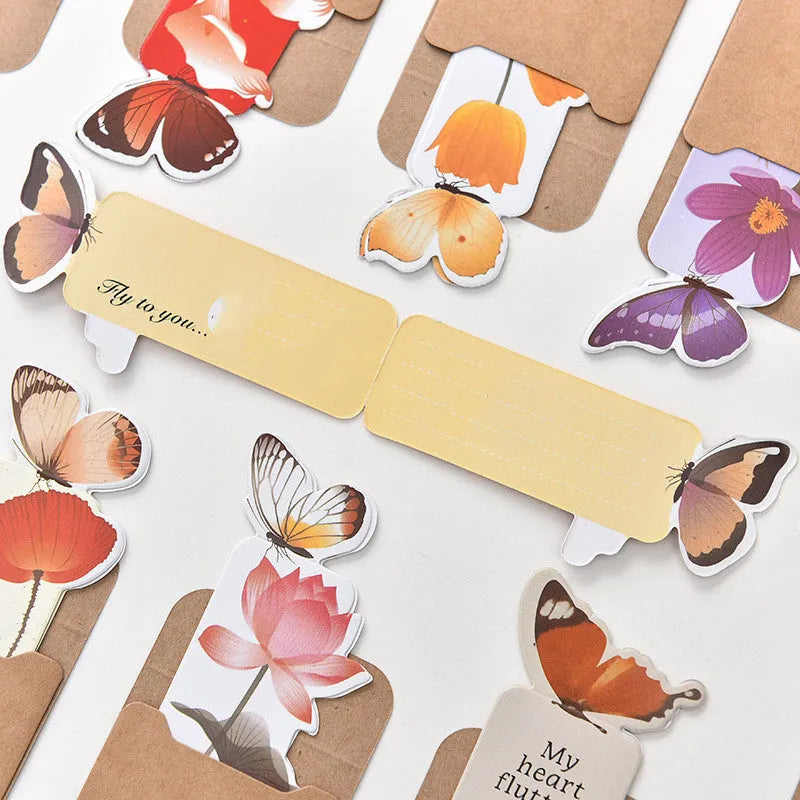 Butterfly-shaped paper bookmark with 13.5cm by 5.5cm dimensions for stationery and gifting