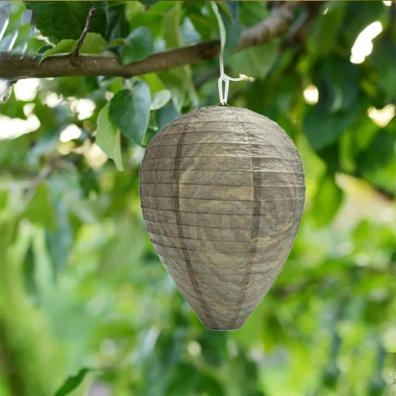 White paper beehive lantern with wire frame measuring 22cm by 28cm