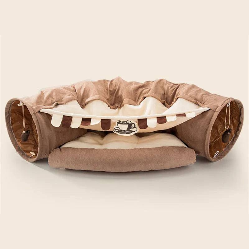 Collapsible cloth cat tunnel toy in pink, shown folded flat and opened for play