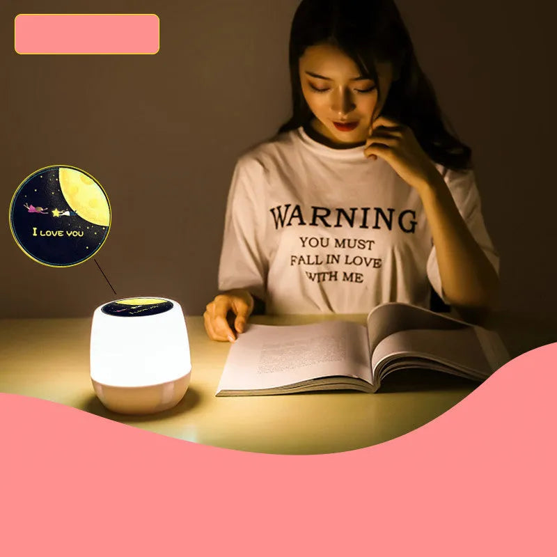 Projector night light displaying rotating star and moon patterns on a bedroom wall