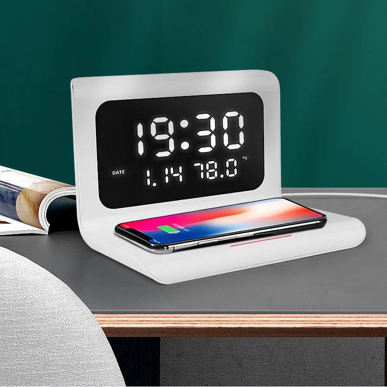 Black wireless charger alarm clock showing time, date, temperature and humidity on display with phone charging