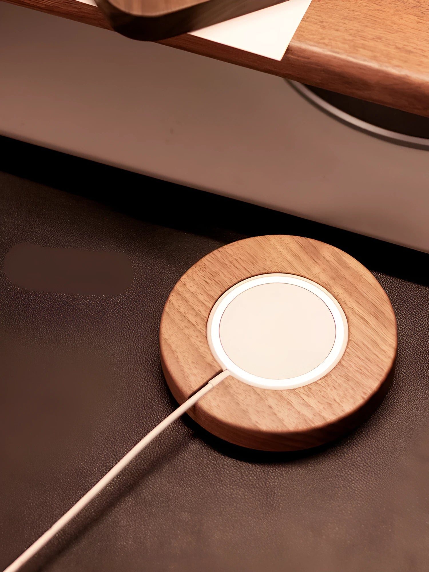 Walnut wood magnetic wireless charging base with MagSafe bracket on desktop