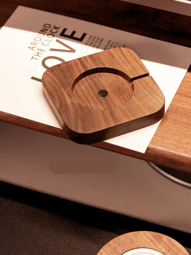 Walnut wood magnetic wireless charging base with MagSafe bracket on desktop